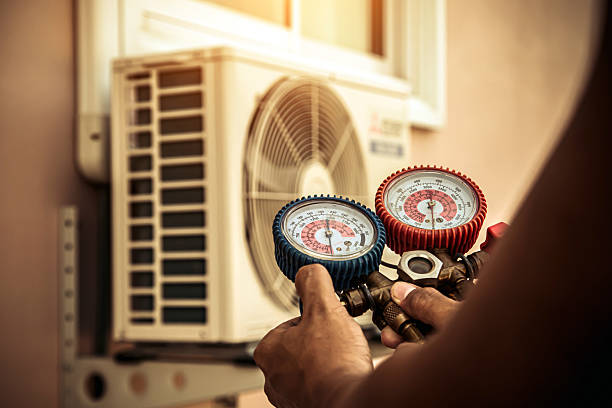 Professional Air Conditioning Service technician working in Warrenton, OR